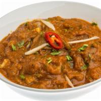 Shrimp Vindaloo · Fresh shrimp cooked with homemade vindaloo sauce and special spices. Served with white basma...