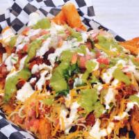 Tucán Fries · Fries, pico de gallo, guacamole, sour cream and cheese, choice of meat
(Adobada Fries will h...