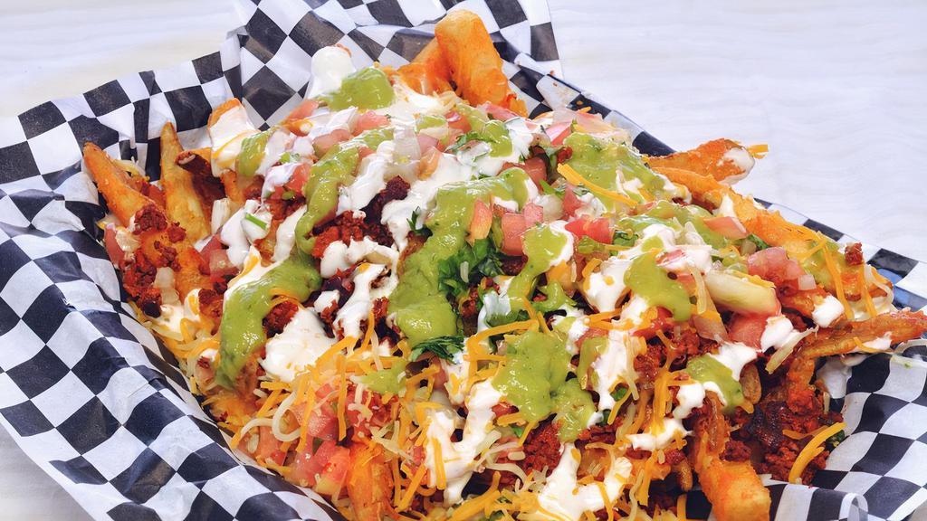 Tucán Fries · Fries, pico de gallo, guacamole, sour cream and cheese, choice of meat
(Adobada Fries will have Cilantro Dressing instead of Sour Cream)