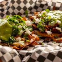 Quesataco · 1 Hand made tortilla and crispy melted cheese, cilantro, onions, guacamole (Adobada Quesotac...
