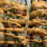 Shrimp Taco · Handmade tortilla, garlic butter shrimp, cole slaw mix, pico de Gallo, Tucan chipotle dressing