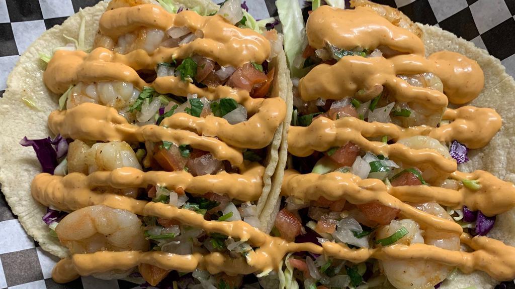Shrimp Taco · Handmade tortilla, garlic butter shrimp, cole slaw mix, pico de Gallo, Tucan chipotle dressing