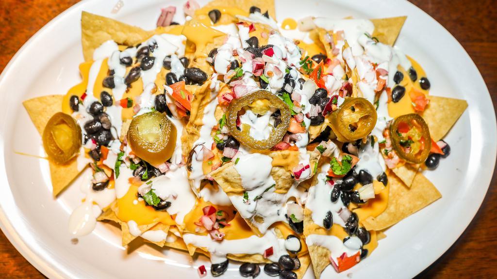 Diablo Nachos · Three cheese, black beans, pico de gallo, and jalapeños. Add chicken or beef for an additional charge.