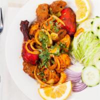 Chicken Makhani · Fresh chicken pieces barbecued in the tandoor, then combined with a delicious mixture of oni...