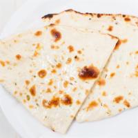Naan · Traditional white bread baked in the tandoor.