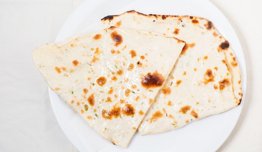Naan · Traditional white bread baked in the tandoor.