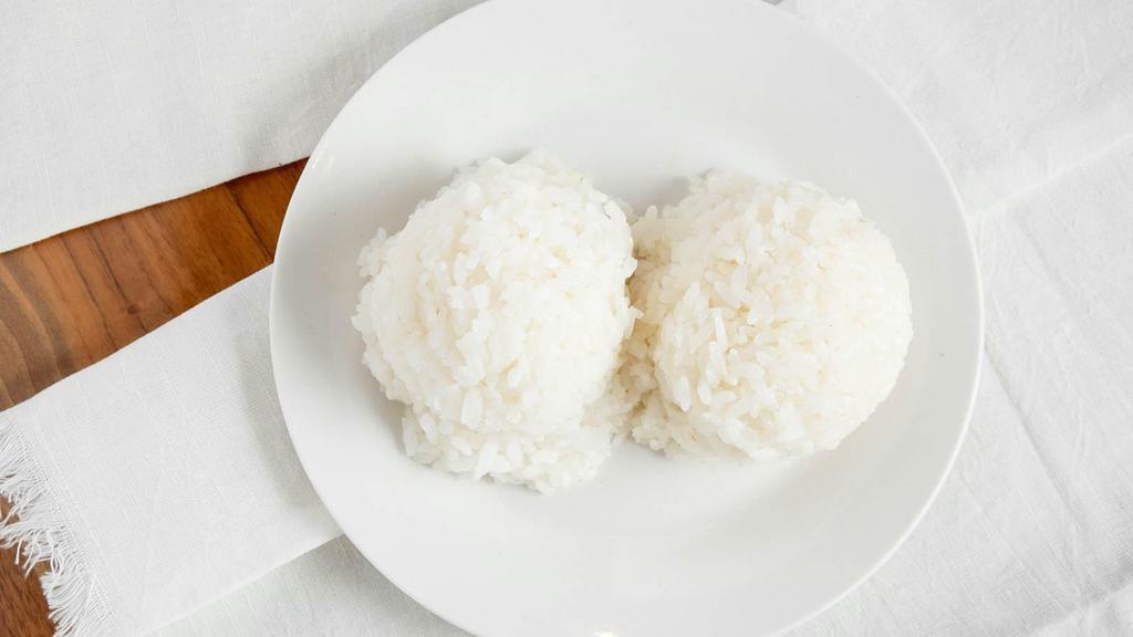 Steamed Rice · 2 scoops of steamed rice.