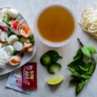 17. Seafood Noodle Soup / Phở Đồ Bien · Rice noodle, shrimps, squids, imitation crabs & fish balls.