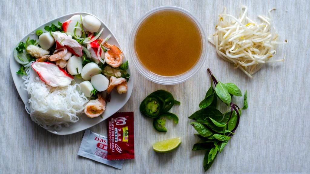 17. Seafood Noodle Soup / Phở Đồ Bien · Rice noodle, shrimps, squids, imitation crabs & fish balls.