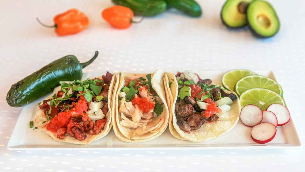Tacos · Choice of Meat, Cilantro, onions & Salsa.