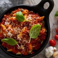 Pasta in Marinara Sauce and Fresh Basil · Simple homestyle pasta with tomato sauce.