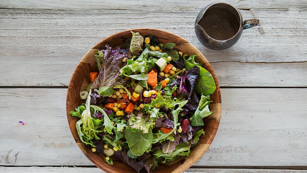 Yogi Salad · Fresh greens with chopped raw veggies, beans, corn, fried chickpea puffs and citrus dressing. Gluten free, and vegan friendly.