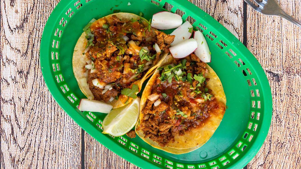 Regular Taco · Your choice of meat with onions, cilantro, and salsa.