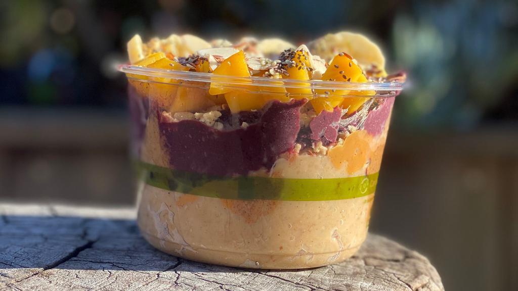 The Flex Blend (Post Workout & Recovery Bowl) · Base: açaí with steel cut oats. Toppings: hemp hearts granola, peanut and almond butter duo, mango, banana, chia, flax and hemp seeds, and bee pollen powder. A protein with workout recovery focused bowl.