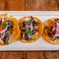 Ribeye, 3 Tacos · Grilled ribeye steak tossed in chimichurri, chipotle aioli, and topped with onions and cilan...