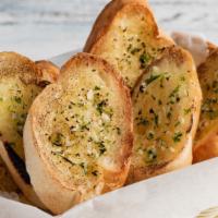 Garlic Bread · Fresh garlic bread topped with seasoning and baked to perfection.