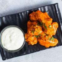 Wing It · Our homemade crispy chicken wings are a crowd favorite. Served with blue cheese. Six pieces.