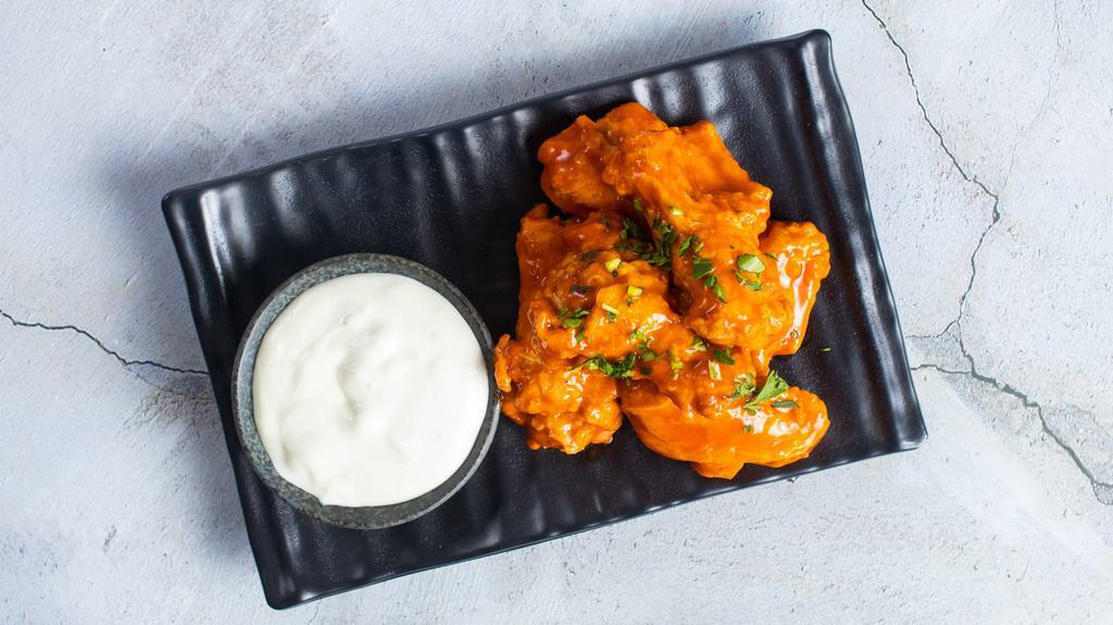 Wing It · Our homemade crispy chicken wings are a crowd favorite. Served with blue cheese. Six pieces.