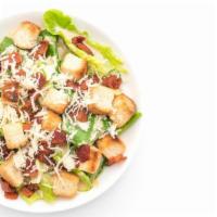 Caesar Salad · Fresh greens, topped with parmesan cheese and herb croutons with a side of caesar dressing.