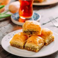 Baklava · Rich and sweet layered pastry filled with chopped nuts and a sweet syrup.