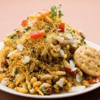 Chatpata Bhel · Puffed rice mixed with crispy wafers topped with Chickpeas, Onion, Potato, Sev and sweet/spi...