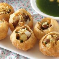 Pani Puri · Crispy puffed wafers filled with Potato, Chickpeas, served with Spicy Mint water and Chutneys