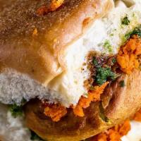 Bombay Vada Pav · Spiced Potato Patty sandwiched between slices of bread/pav served with Chutneys
