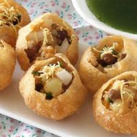 Pani Puri · Crispy puffed wafers filled with Potato, Chickpeas, and Sprouts served with Spicy Mint water...
