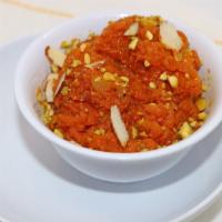 Gajar Halwa · Authentic Carrot dessert - Shredded carrots pudding mixed with nuts and dried fruits.