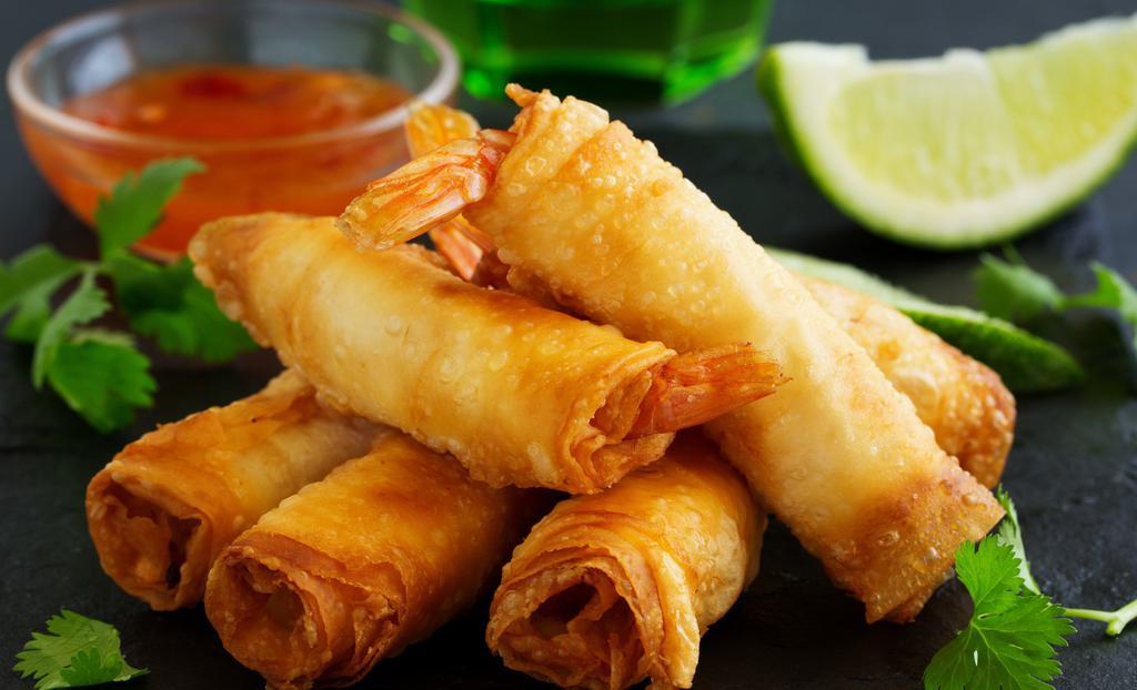 Spring Rolls · Deep-fried spring rolls stuffed with bean noodles and vegetables. Served with sweet and sour sauce.