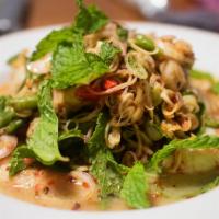 Pla Koong (Prawn Salad) · Prawn salad. Grilled prawns with fresh lime juice, onions, mint leaves, chili, and cilantro....