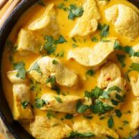 Yellow Curry · Meat with yellow curry with yellow onions, potatoes, and coconut milk.