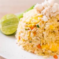 Crab Fried Rice · Fried rice with crab, garlic, carrot, pea and yellow onions.