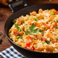 Fried Rice · Fried rice with garlic, egg, carrot, pea and yellow onions.