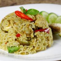 Thai Green Curry Fried Rice · Fried rice with green curry, garlic, chili, bell peppers, pea, basil, and yellow onions.