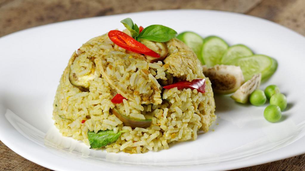 Thai Green Curry Fried Rice · Fried rice with green curry, garlic, chili, bell peppers, pea, basil, and yellow onions.