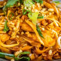Pad Thai · Stir-fried rice noodles with meat, egg, tofu, bean sprouts, green onions, and ground peanut.