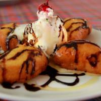 Fried Banana with Ice Cream · Melt butter in saucepan, add brown sugar, salt, vanilla extract and cinnamon. Stir until tot...