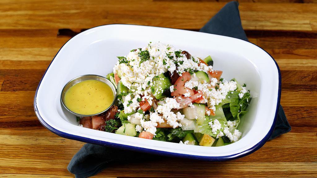 Greek Salad · Romaine lettuce with red onion, tomato, cucumber, red onion, bell pepper, Kalimantan olives & Greek feta cheese, drizzled in  our house dressing