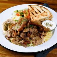 Lamb & Beef Gyros Plate · Slowly cooked Lamb & Beef Gyros slices. Served with hummus, rice & pita bread