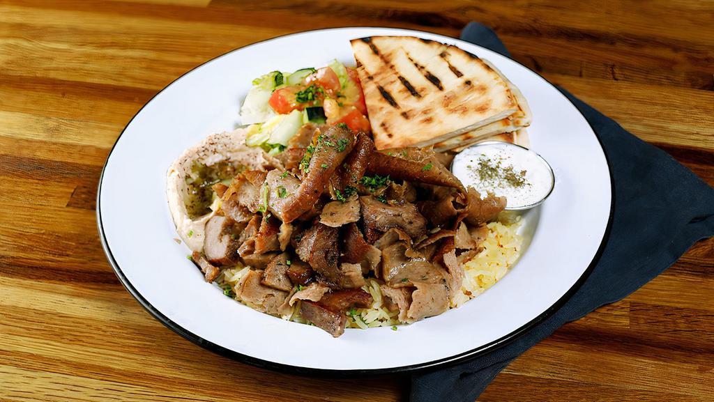 Lamb & Beef Gyros Plate · Slowly cooked Lamb & Beef Gyros slices. Served with hummus, rice & pita bread