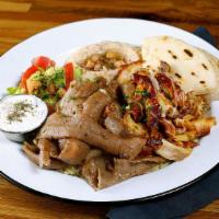 Combo Gyros Plate · Slowly cooked Lamb Beef & Chicken Gyros slices. Served with hummus, rice & pita bread