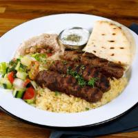 Kofte Kebab Plate · Grilled marinated ground beef. Served with hummus, rice, tzatziki & pita bread