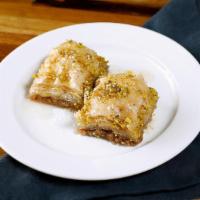 Baklava · Layers of phyllo dough stuffed with crushed walnuts,, butter & simple syrup (2 pc.)