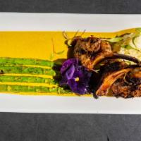 Grilled Lamb · Grilled marinated lamb rack, coconut rice, curry sauce drizzle, asparagus with chopped cucum...