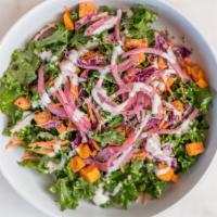 Kale Delight · Massaged raw kale, roasted sweet potato, shaved red cabbage, pickled red onion, shredded car...