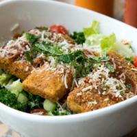 Crispy BBQ Tofu Salad · vegetarian. Crispy BBQ tofu, kale, cucumber, cherry tomatoes, mint, black pepper parmesan dr...