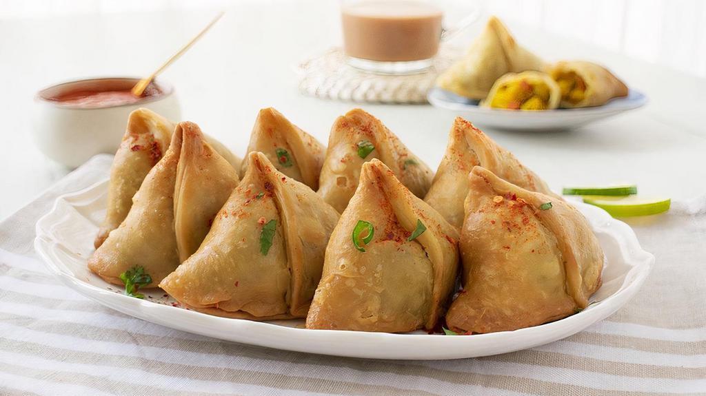 ZU8. Samosas (Vegetarian) · Hand-made wheat flour wraps fried and filled with potatoes, onions, and spices served with our special house sauce. Vegetarian.