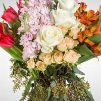 Soft Burn By BloomNation™ · Product Information
This arrangement contains alstroemeria, tulips, roses, and other seasona...
