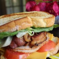Turkey Club Sandwich · Thinly sliced deli turkey, bacon, American cheese, fresh lettuce and sliced tomato with crea...